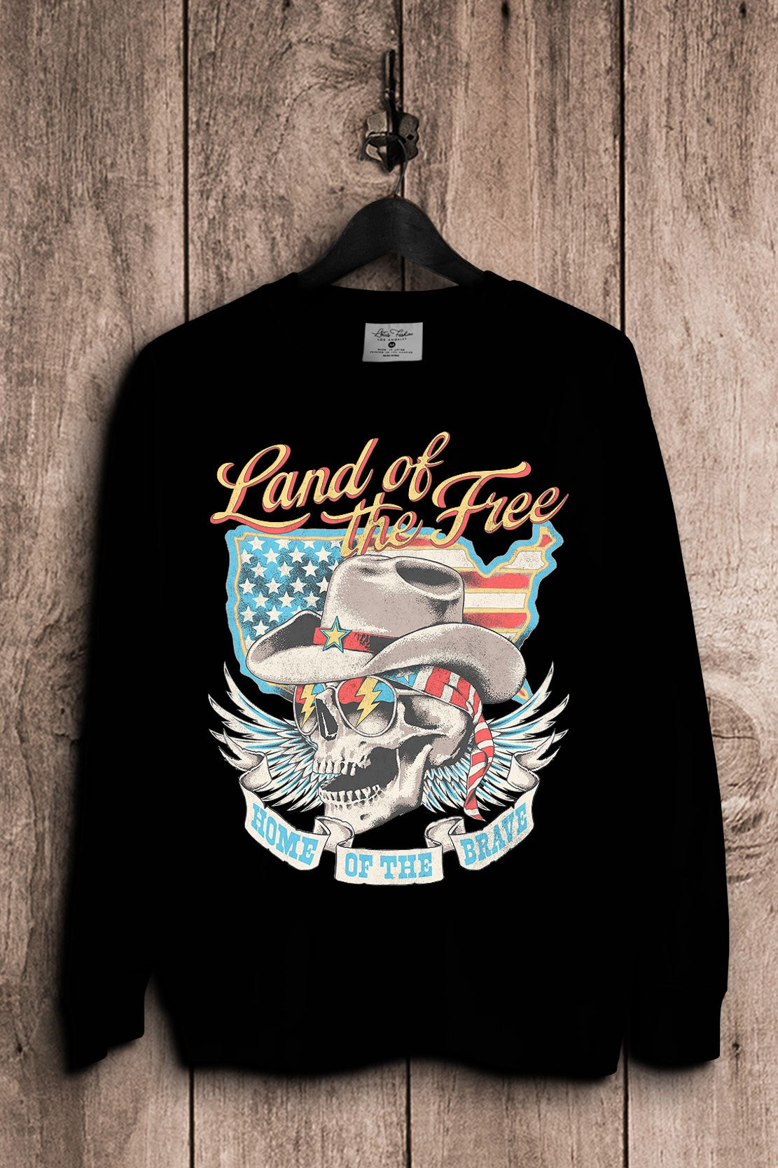Black French terry sweatshirt featuring a cowboy skull in a western hat, star sunglasses and American flag bandana with wings, a flag-filled map and patriotic lettering.