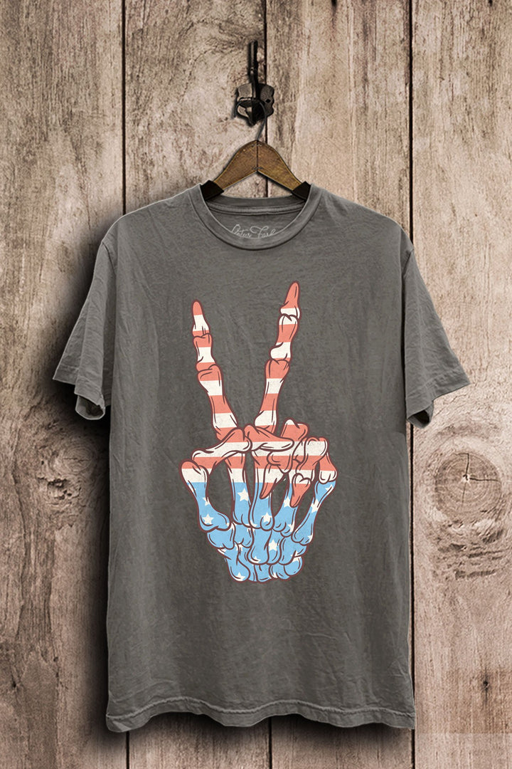 Stone gray mineral-washed plus-size boyfriend tee featuring a skeleton hand peace sign filled with red, white, and blue stars and stripes.