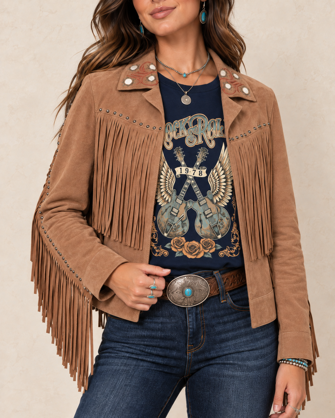 Warm saddle-tan suede leather jacket with an embroidered western collar, antique-tone studs, and long fringe across the front, back, and sleeves.