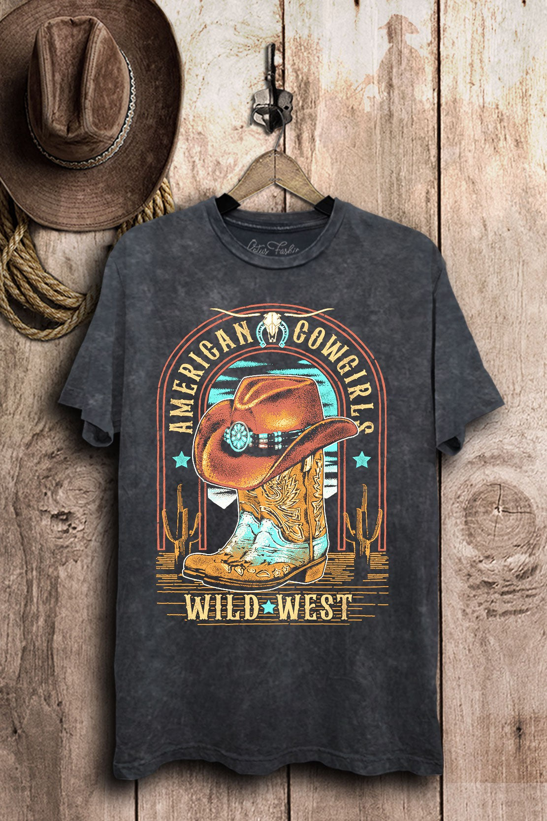 Vintage black mineral-wash boyfriend tee featuring an American Cowgirls Wild West hat and boots graphic.