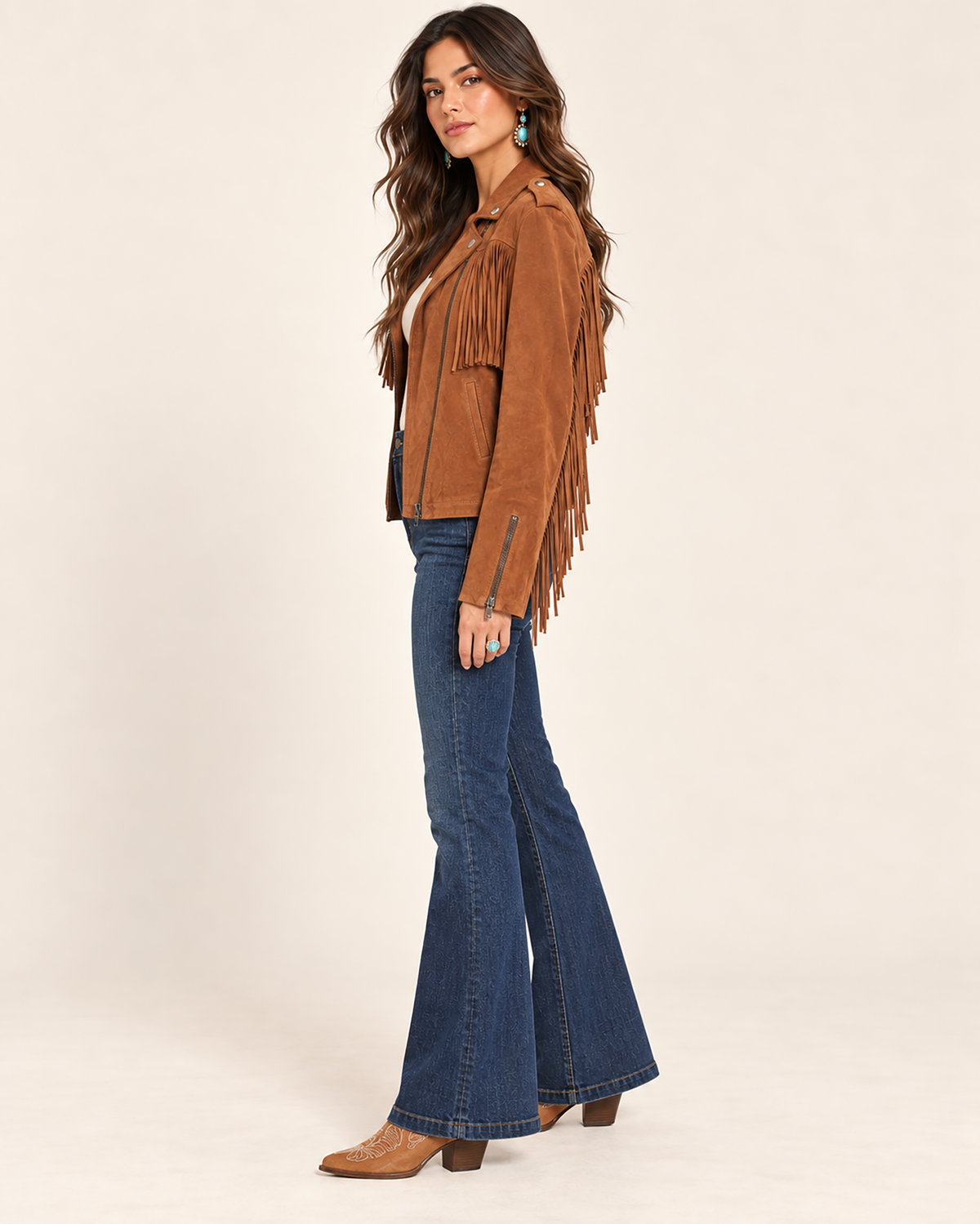 Brown suede leather western jacket with cascading fringe, an asymmetric zip front, snap lapels, and shoulder epaulettes.