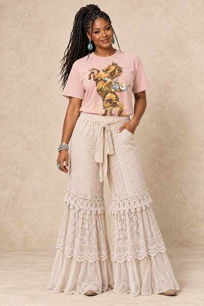 Latte wide-leg cloud pants with an elastic waist, self-tie sash, and tiered panels of mixed lace, netting, and cotton voile.
