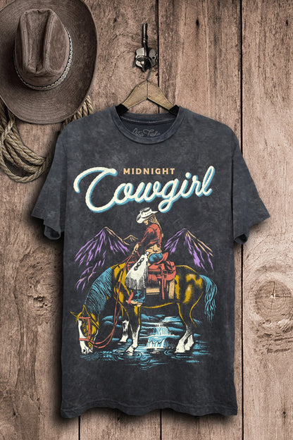 Vintage black mineral-wash boyfriend tee featuring colorful artwork of a cowgirl on horseback beneath purple mountains beside a flowing stream.