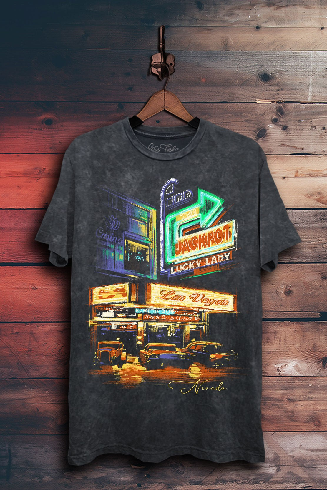 Vintage black mineral-wash boyfriend tee featuring colorful neon casino signs, classic cars, and Las Vegas, Nevada artwork.