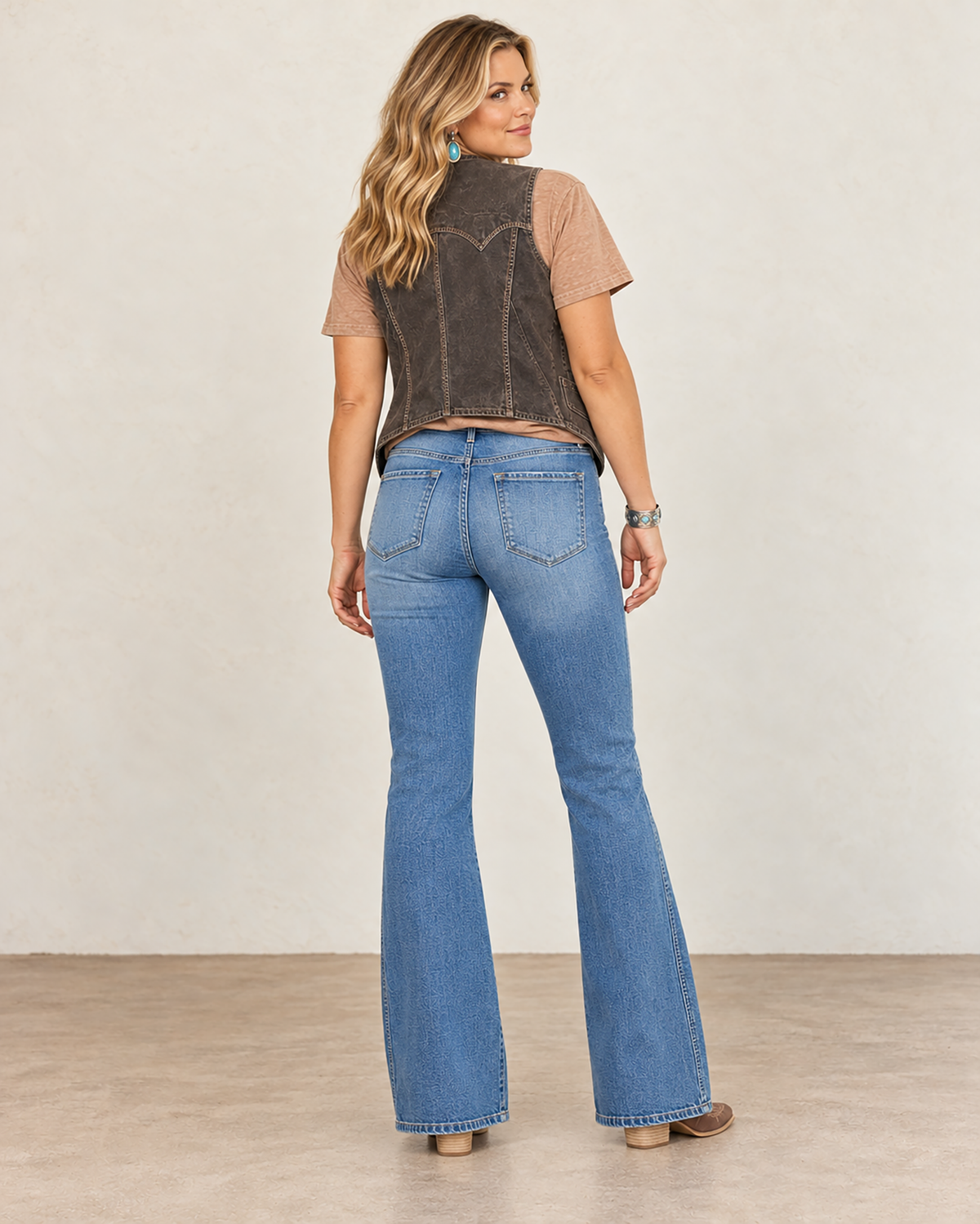 Medium-wash KanCan high-rise comfort-stretch jeans with double-stitched side seams and a clean full-length flared leg.