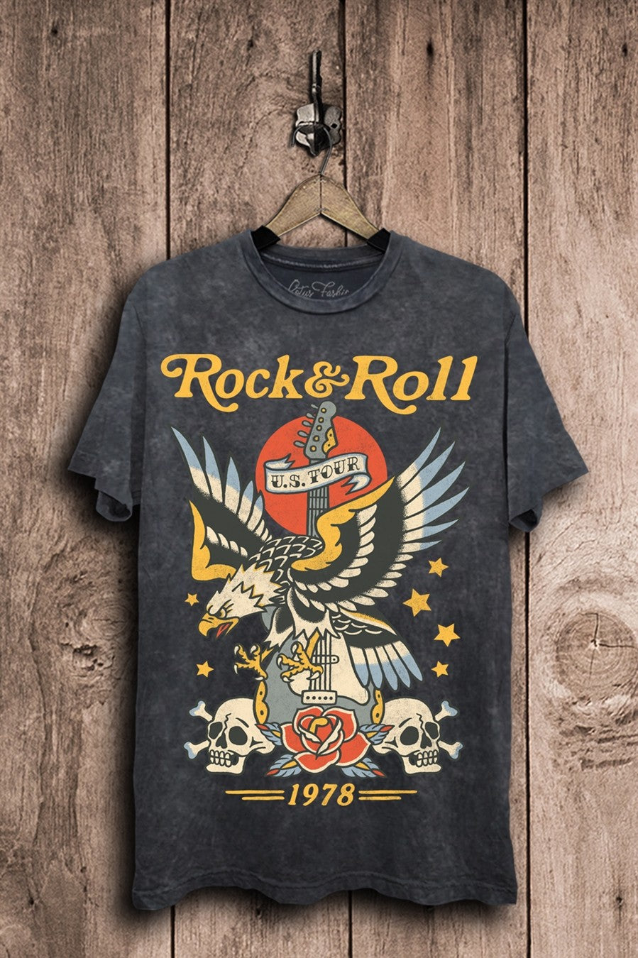 Vintage black mineral-washed boyfriend tee featuring a tattoo-style eagle over a guitar, rose, twin skulls, stars, and Rock & Roll U.S. Tour lettering.