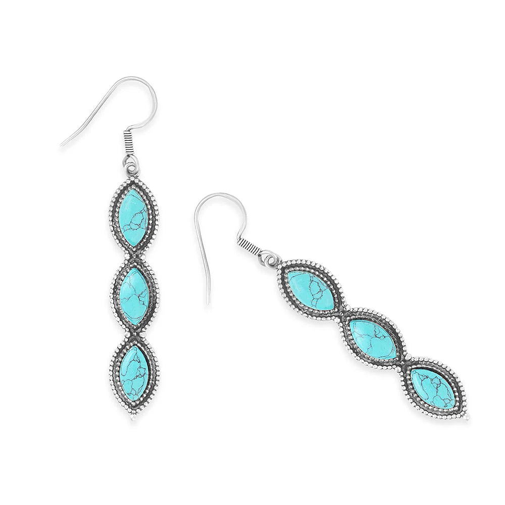 Turquoise stone earrings with silver hooks on a white background