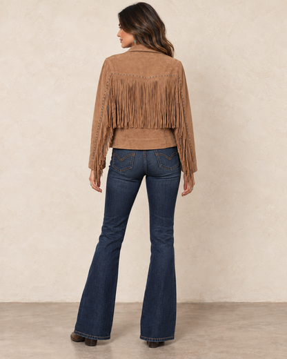 Warm saddle-tan suede leather jacket with an embroidered western collar, antique-tone studs, and long fringe across the front, back, and sleeves.